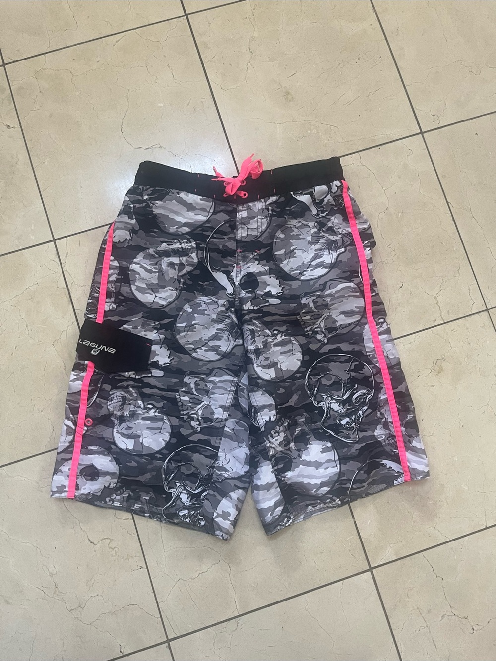 Laguna B Black and White Polyester Lined Garment swim trunks.